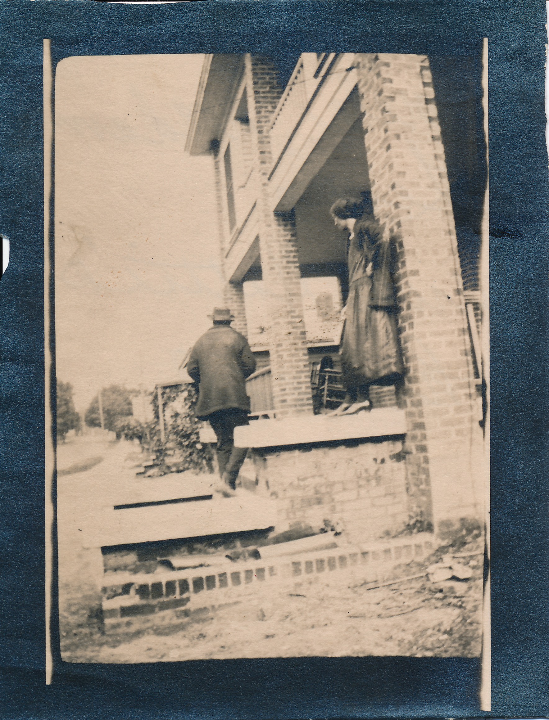Hattie Lewis &amp; Needham Lewis in front of hotel under construction, undated