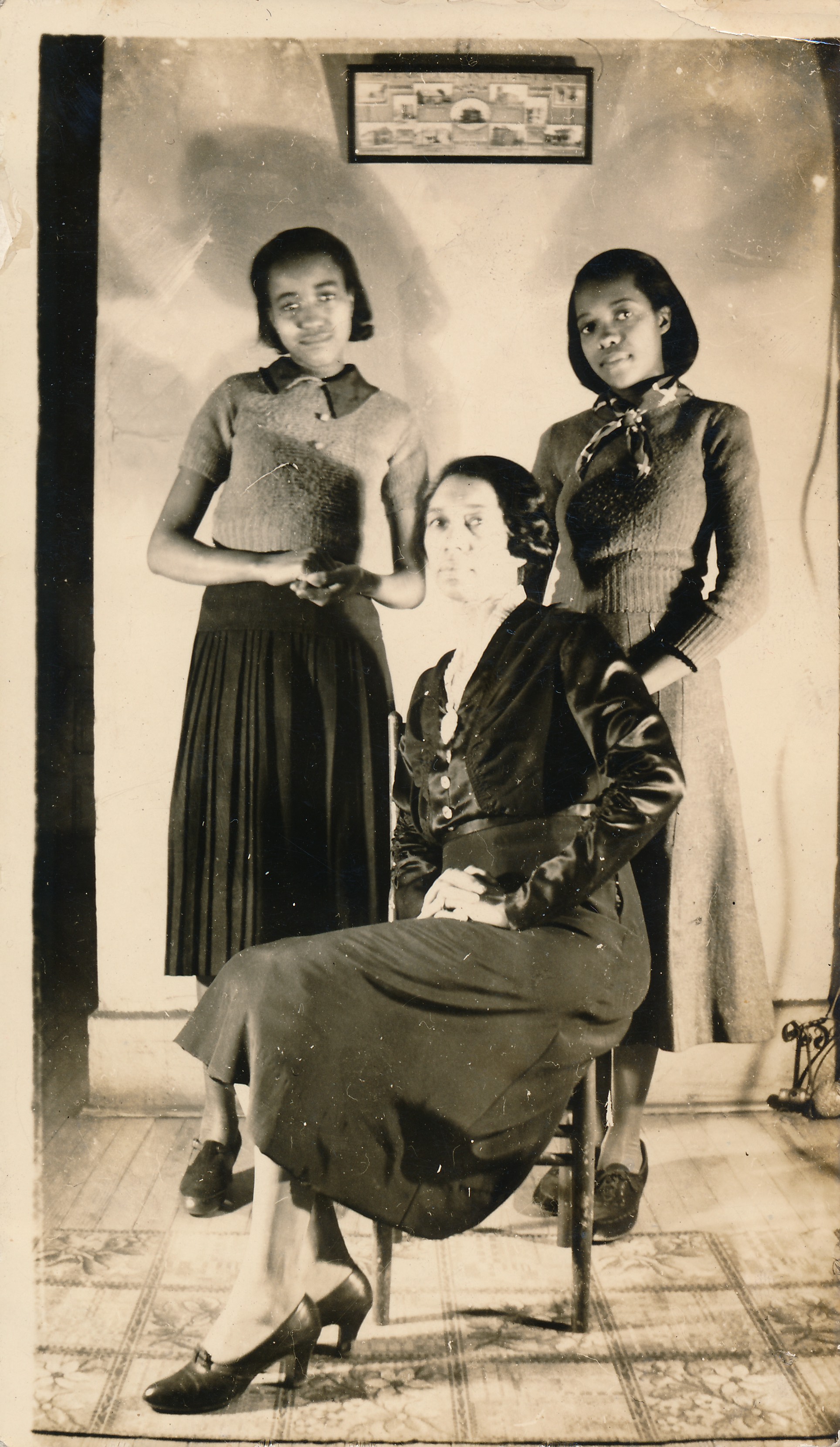 Hattie Lewis (seated) with nieces Lucille Griswold Paige &amp; Fannie Griswold Kirksey, undated. Lucille Griswold would be the next owner of the business and rename it the DeLuxe Hotel.