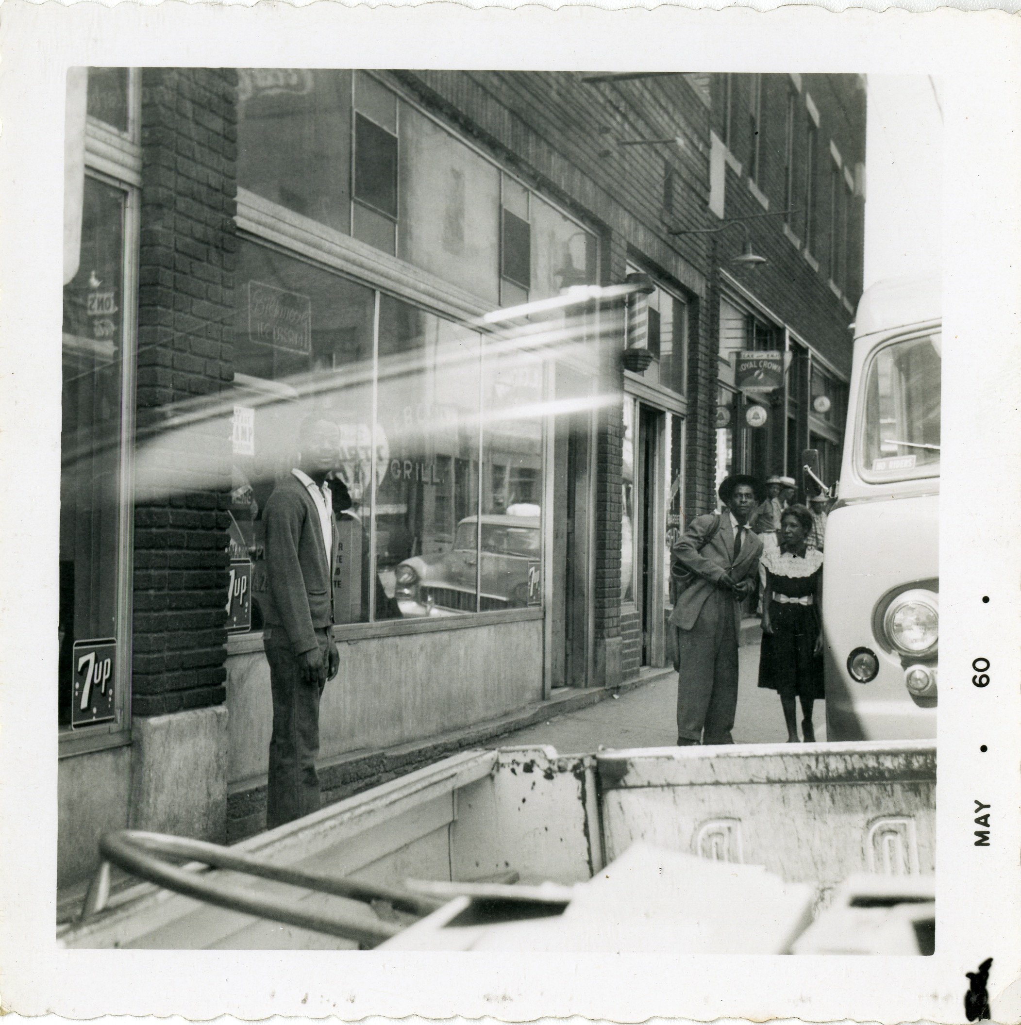 Street scene and exterior of Ebony Grill &amp; Esquire Barbershop, 1960