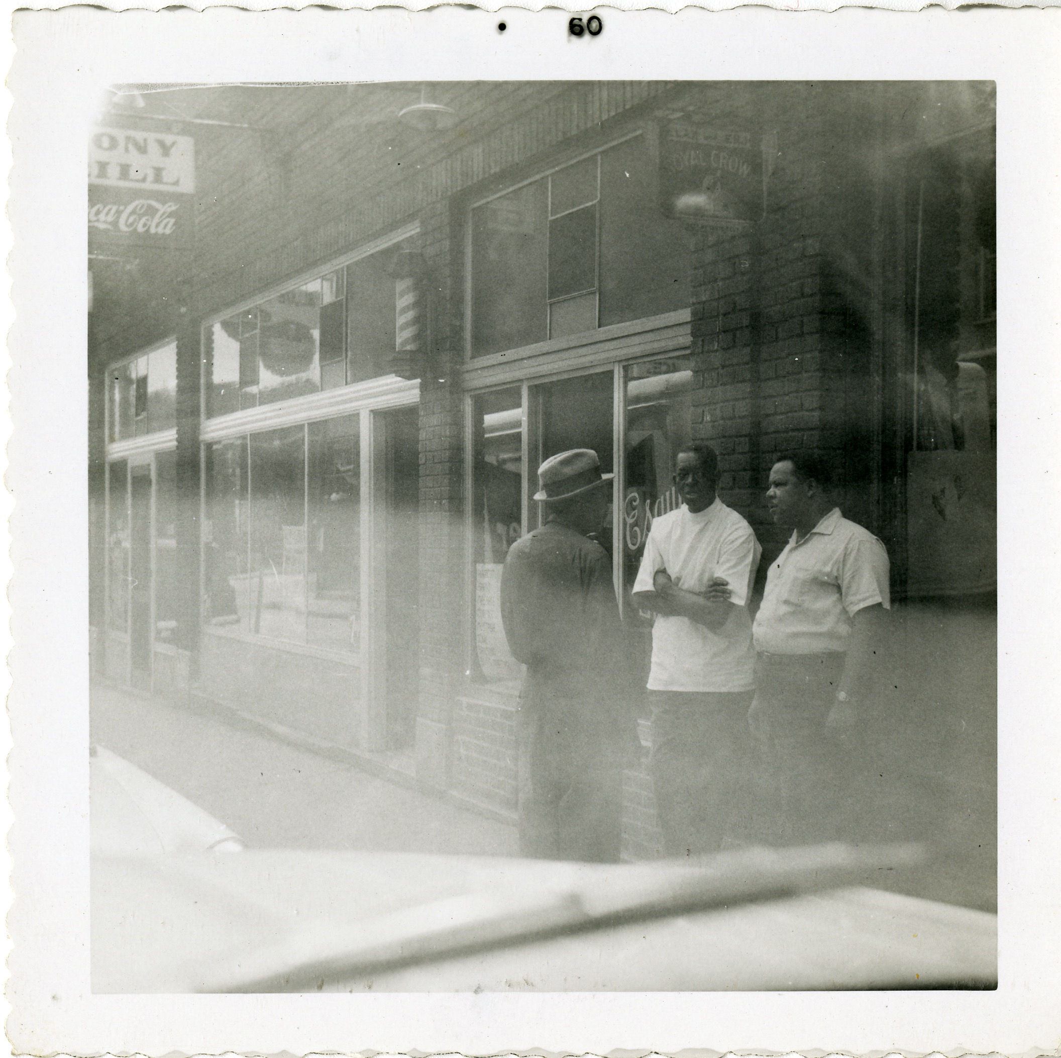 Street scene and exterior of Ebony Grill &amp; Esquire Barbershop, 1960
