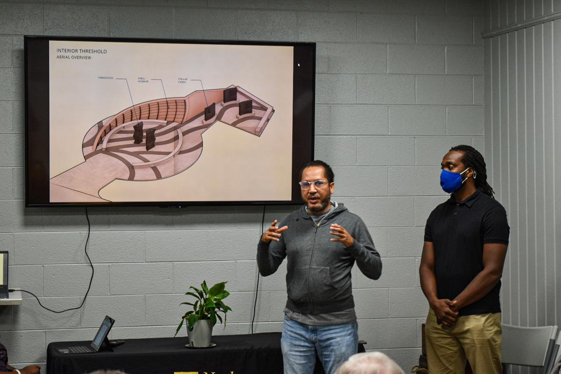 Artist Team speaking to community members