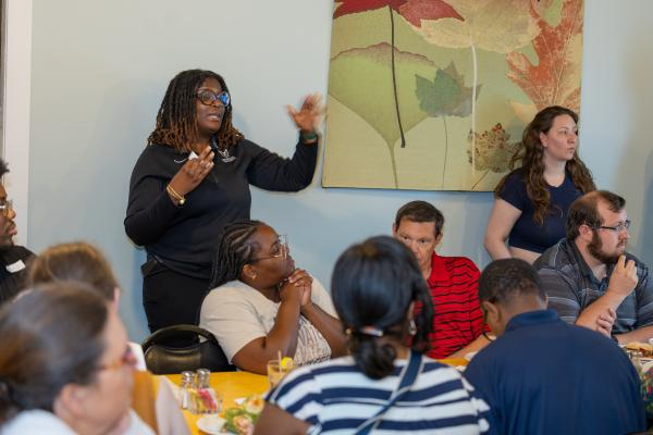 Shafantae Desinord speaking to a group of teachers