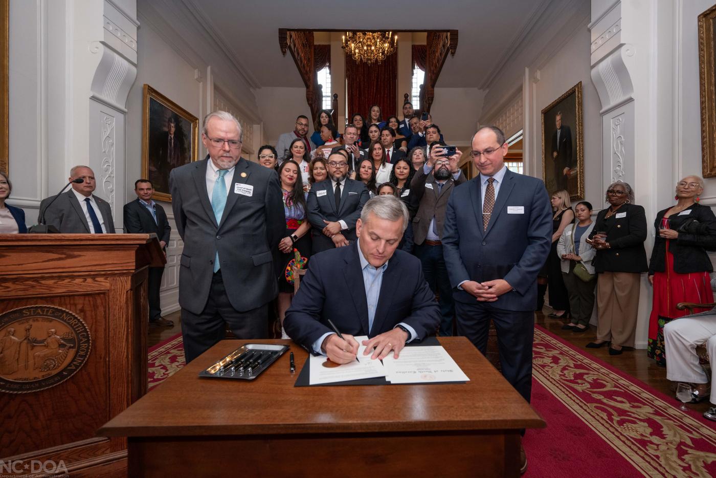 Governor Josh Stein signs the Executive Order reestablishing the Advisory Council on Latino Affairs