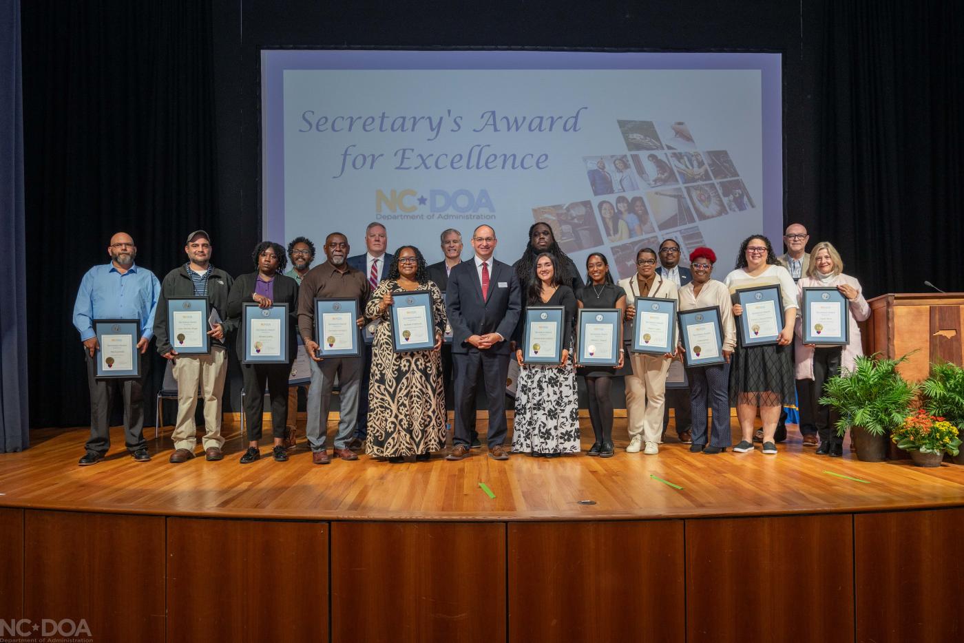 Secretary Gabe Esparza stands with the 2025 Secretary's Award for Excellence honorees