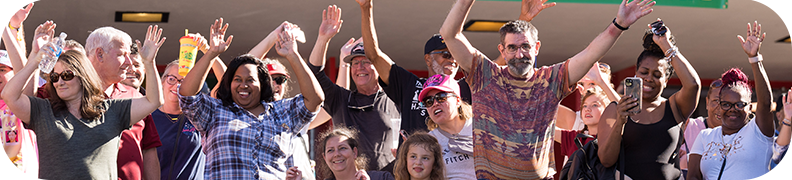 Group of People with their hands raised