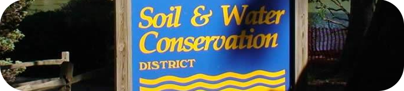Blue sign with yellow writing Soil & Water Conservation