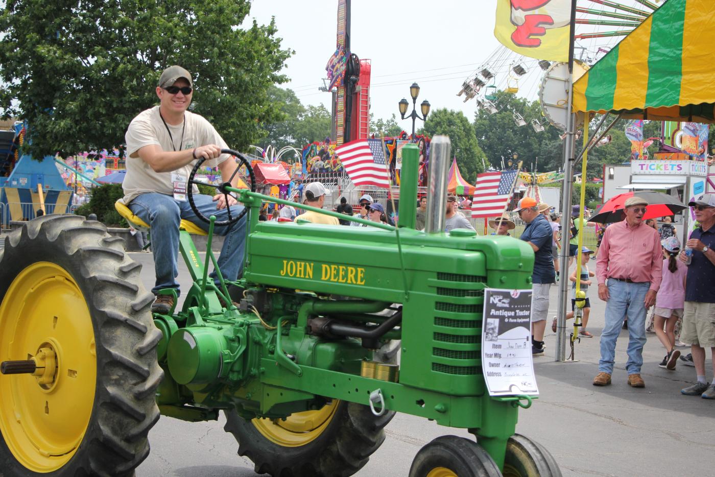 Man driving John Deere tractor