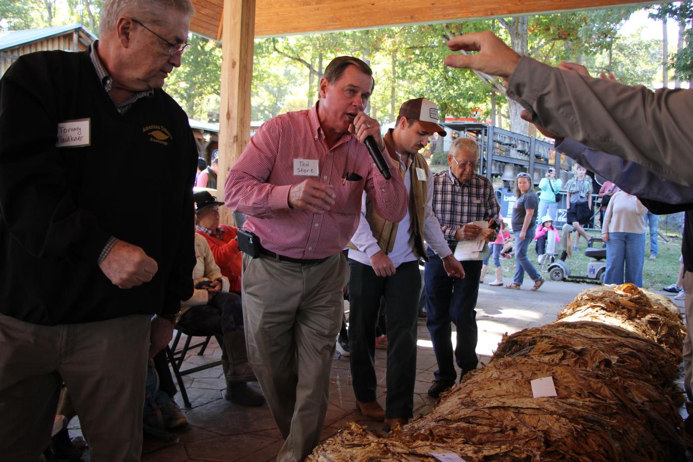 A tobacco auctioneer calls for bids in the mock tobacco auction from 2025.