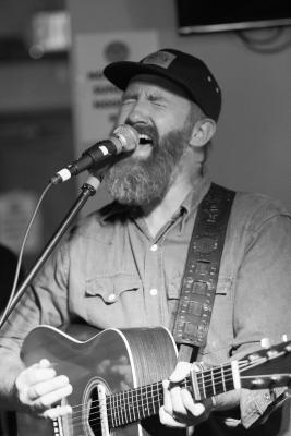 B&W Man Singing Into A Mic