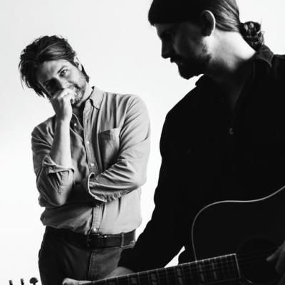 Two men looking at one another 