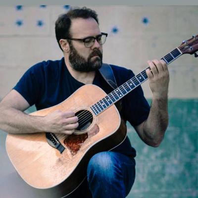Man playing acoustic guitar 