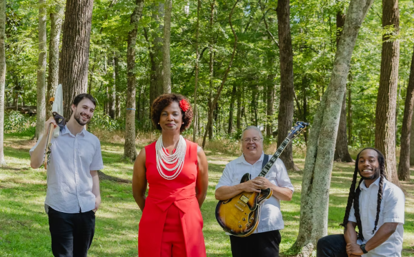 Band members standing in the forest