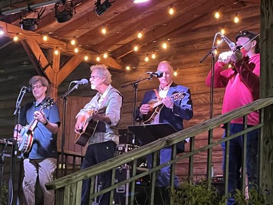 Four men playing instruments on Heritage Stage
