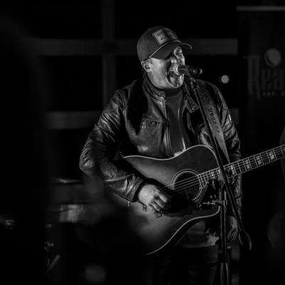 Man singing and playing the guitar