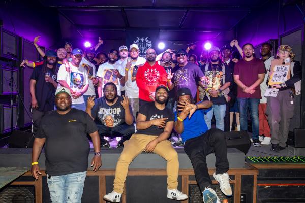 Group of Men posing on Stage