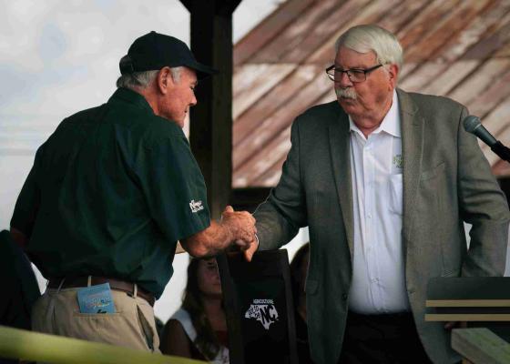 Dr. Reich shaking hands with Commissioner Troxler