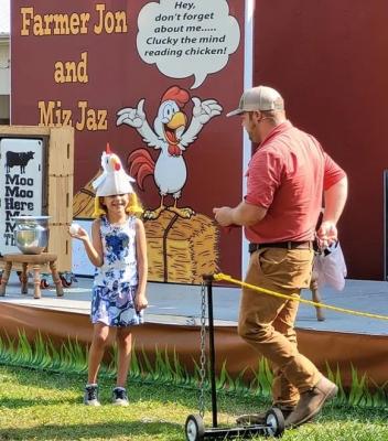 Girl wearing a chicken hat