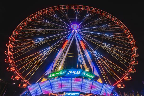 Night Photo of Large Ferris Wheel Lite Up