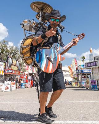 Man in Cowboy Hat with a Guitar