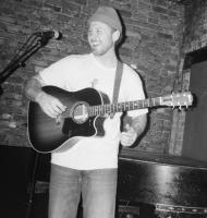 Gentleman playing a guitar