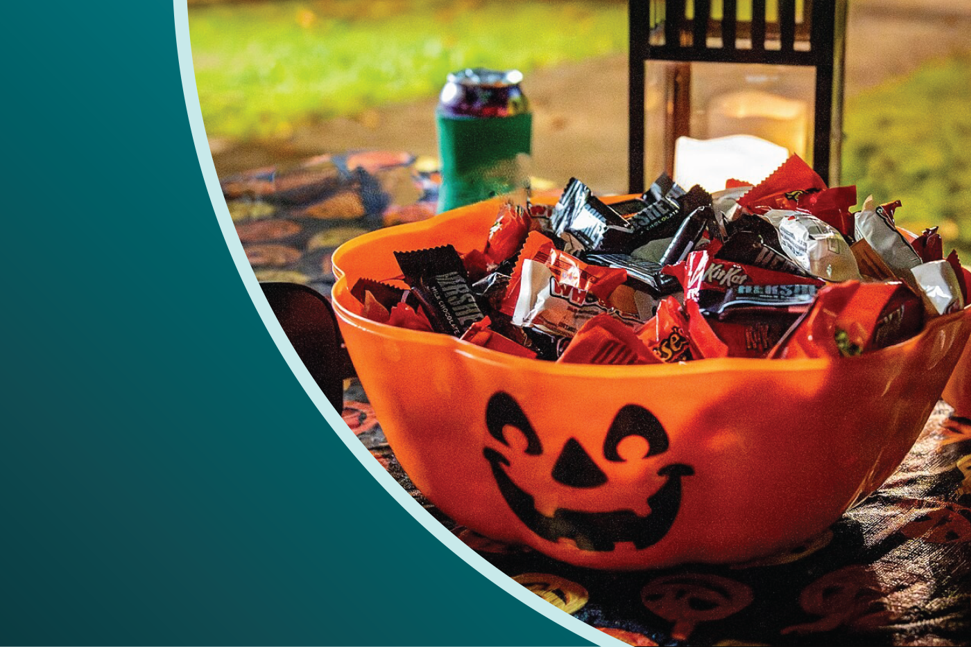 A pumpkin bowl with Halloween candy inside