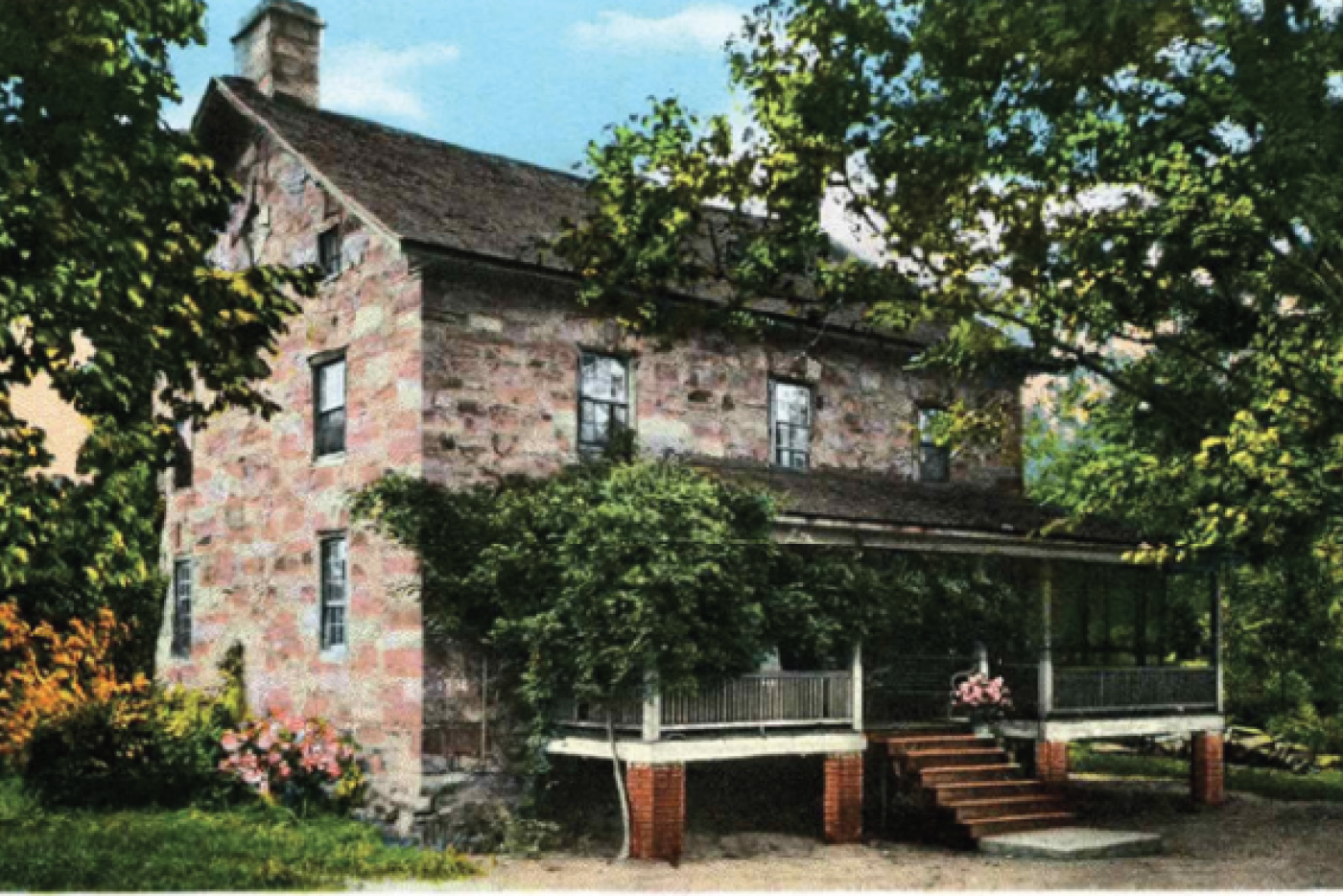 brick house with many trees around it