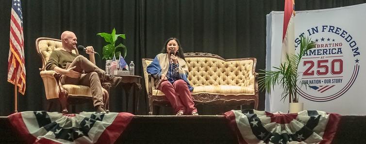panel of speakers on a stage