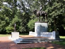 Statue of a general riding a horse on the grounds of Guliford Courthouse