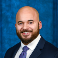 A headshot of AIHC Associate Director Quinn West Godwin.