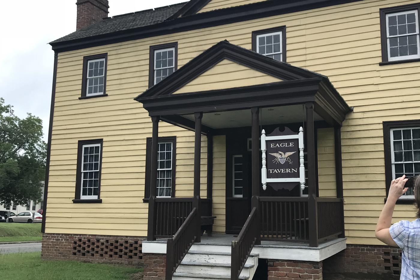 Eagle tavern at Halifax SHS NC. 2 story yellow house with large chimneys on gable ends.