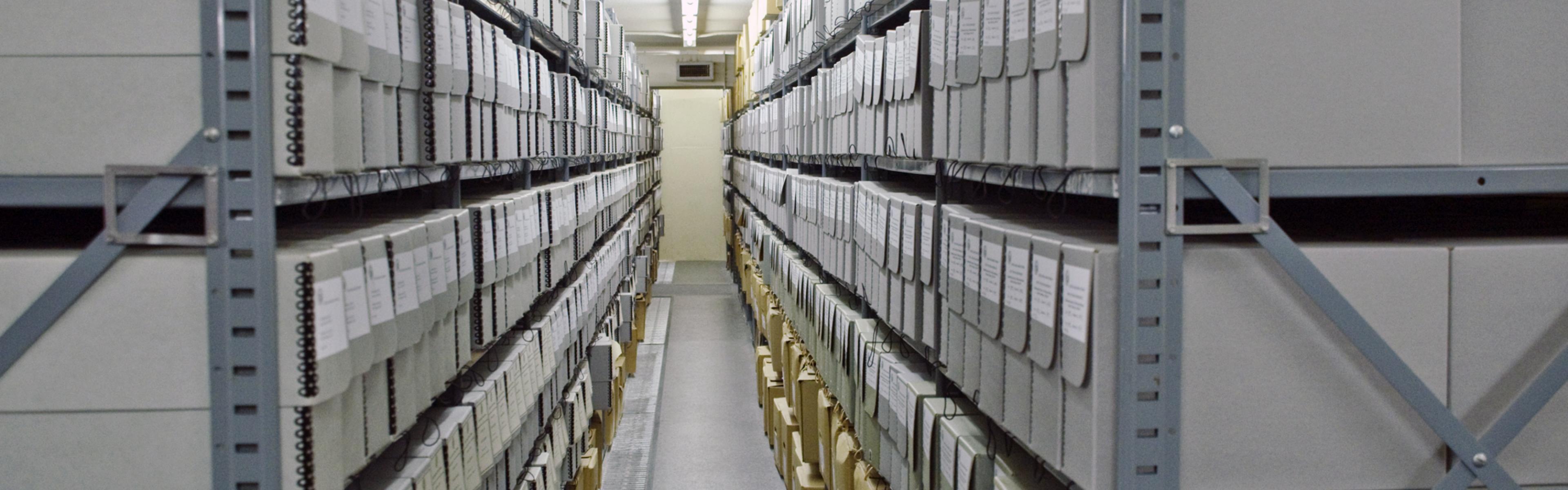 View between two stacks holding archival boxes