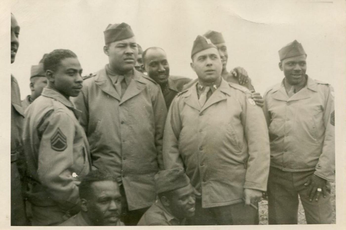 Eight African American soliders standing in uniform