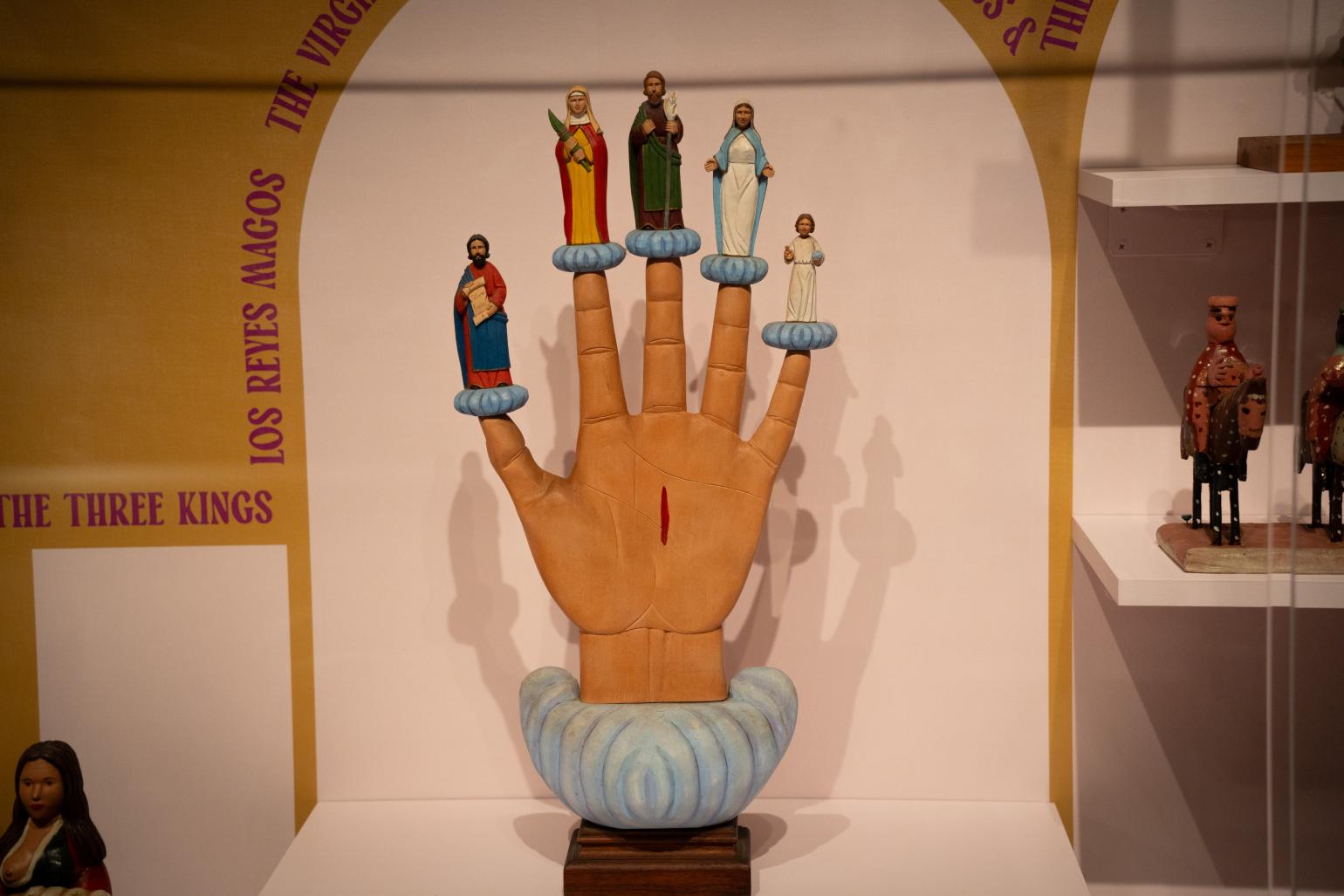 Carved wooden santo de palo hand. Courtesy of the Mint Museum.