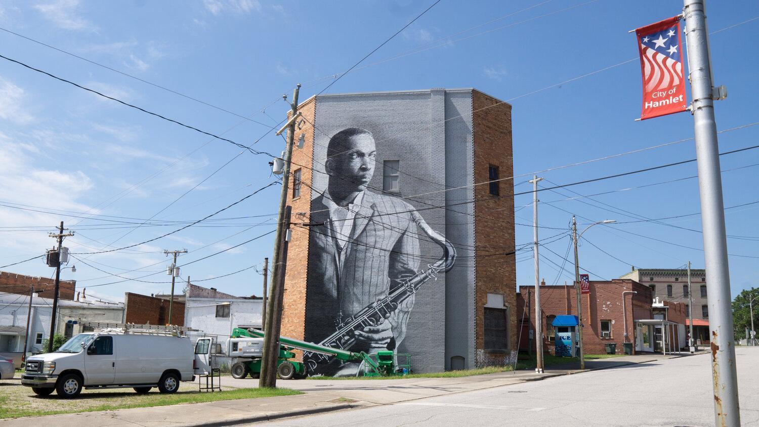 wide-shot of mural of John Coltrane in Hamlet, NC