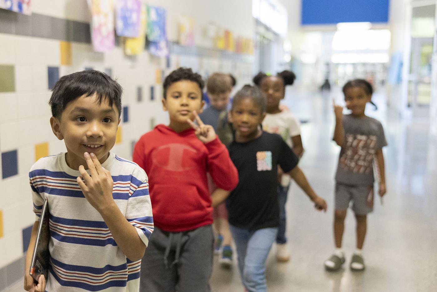 Students at Royal Oaks School of the Arts walking down a school hallway. Photo by Tibor Nemeth, courtesy of the NC Arts Council
