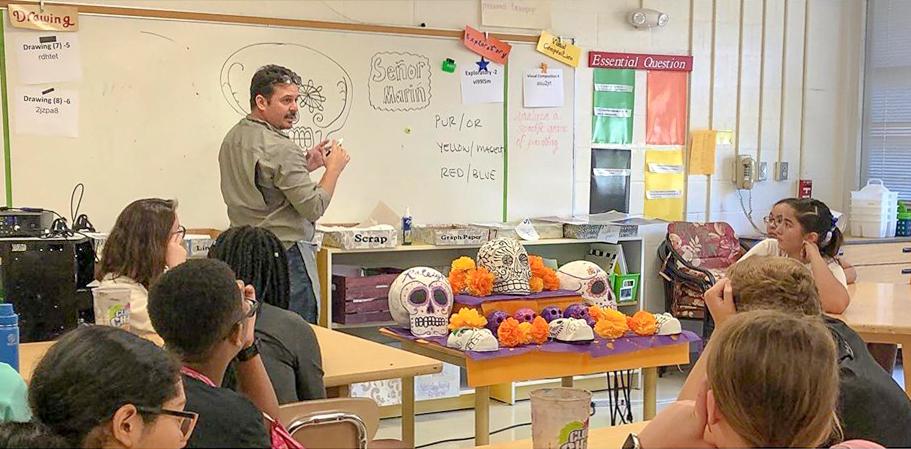 Painter and teaching artist Peter Marin doing a residency and teaching a group of young students