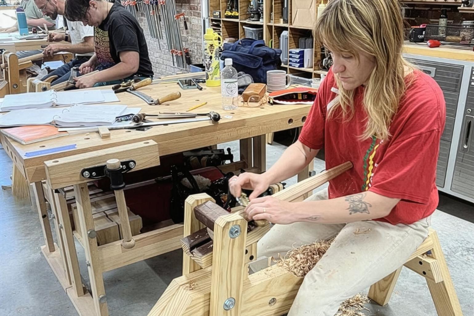 An artist woodworking. 