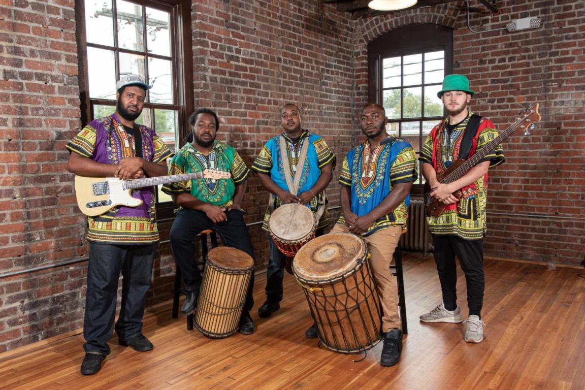 Africa Unplugged, five member pose with their instruments