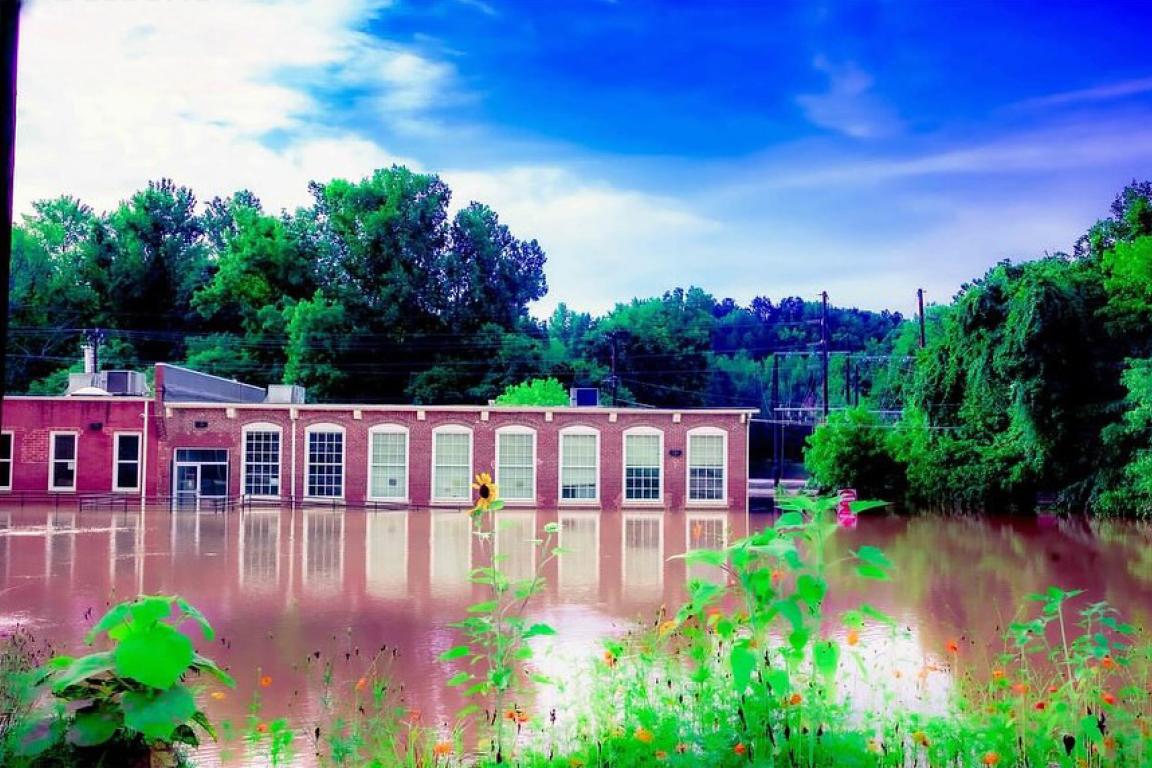 The flooded exterior of the Orange County Arts Commission building post Tropical Storm Chantal. Photo by Steve Murray