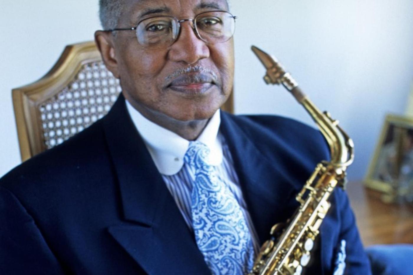 Bill Myers smiling at the camera in a blue suit