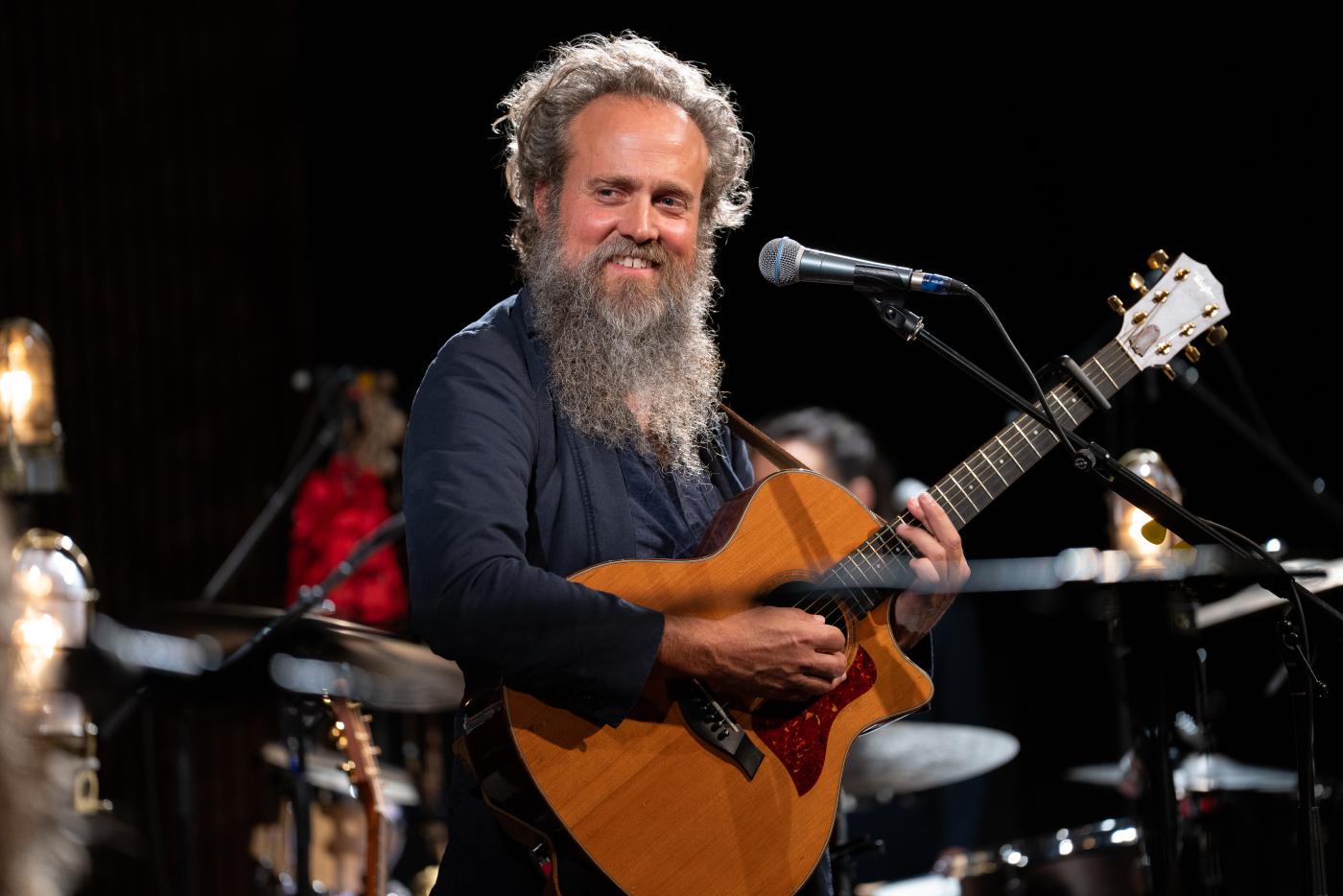 Singer/songwriter Sam Beam with a guitar
