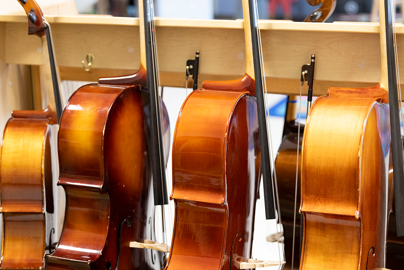a row of violins in a music classroom