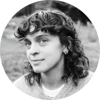 Libby Rodenbough, a women with shoulder-length curly hair and bangs