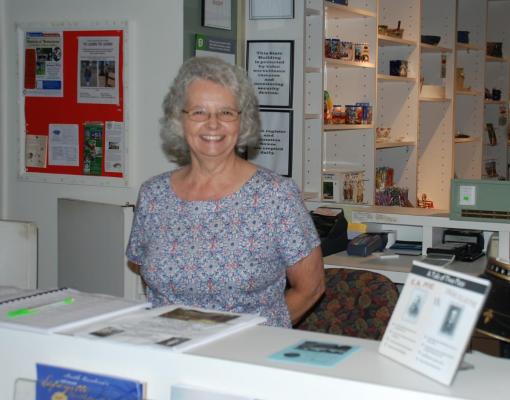 Woman volunteer at desk