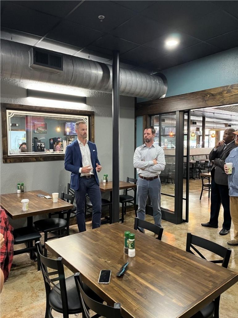 Commerce Secretary Lee Lilley speaks with people involved with Helene recovery