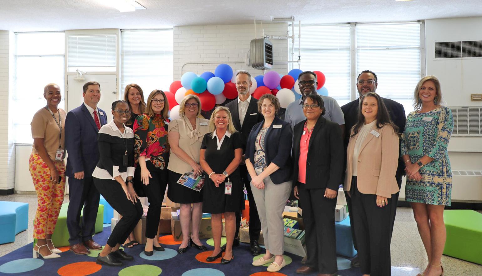 NC Commerce and Lenoir County Schools leadership posing for a photo..