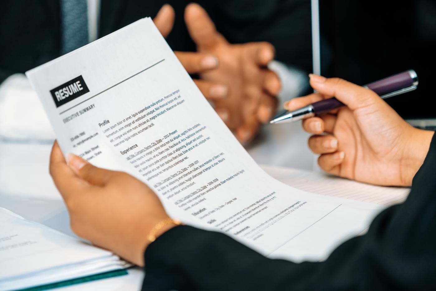 individual looking at a resume