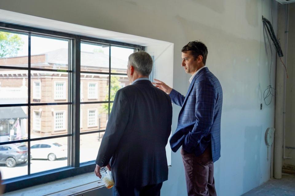 Governor Stein looks out at downtown Edenton from a repurposed building, supported by a Rural Infrastructure Authority grant.