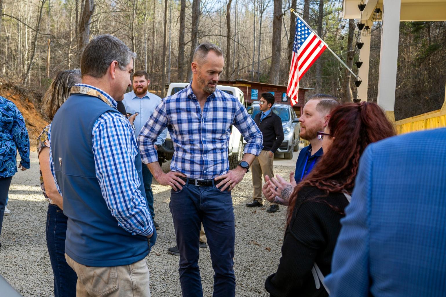 Lee Lilley speaks to group outside Renew NC home