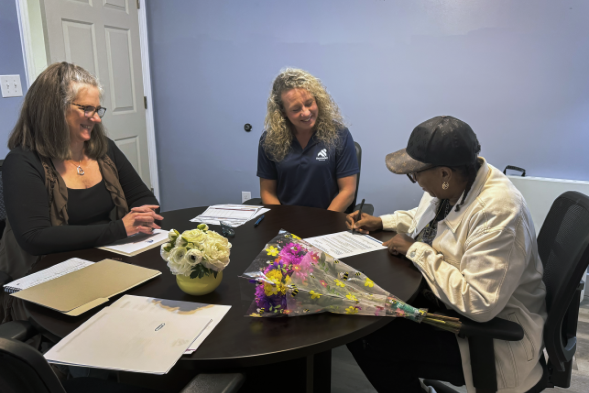 Renew NC applicant signs Single-Family Housing Program grant contract